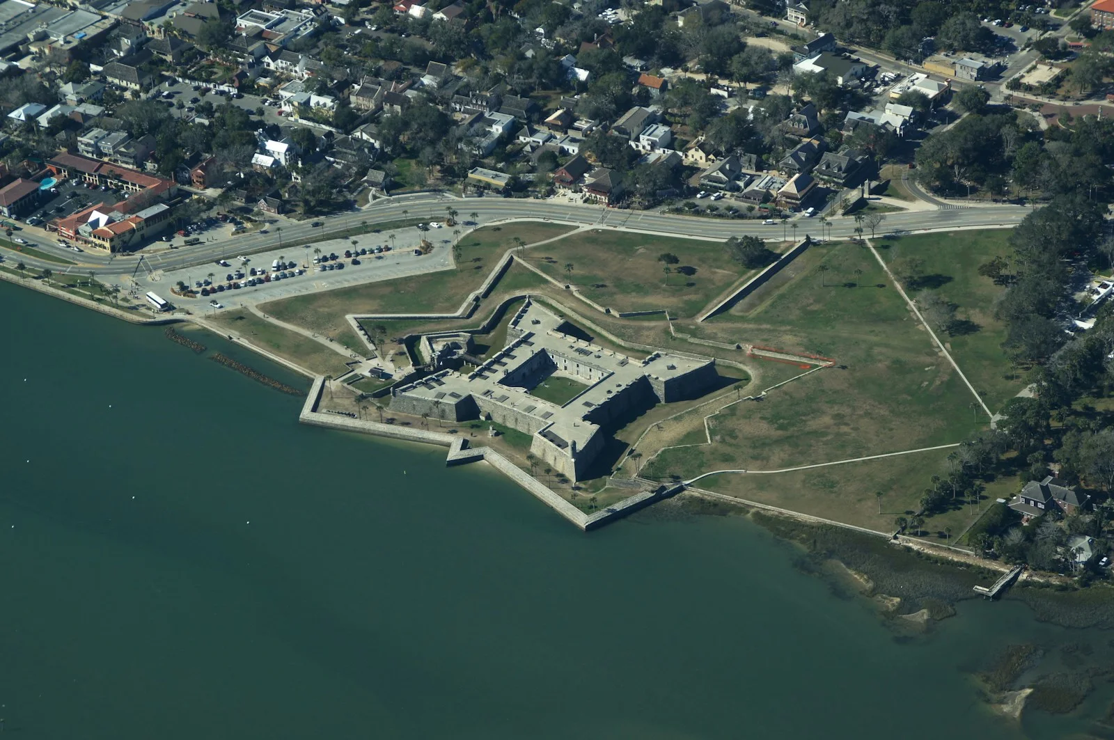 an aerial view of a fort on the water