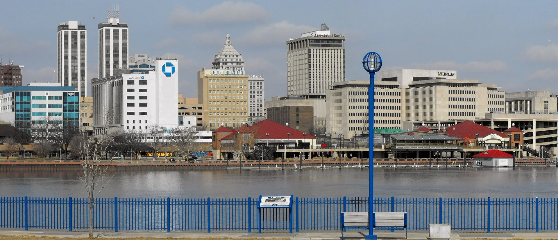 This is a photograph shot in panoramic format from the East Peoria side of the river of downtown Peoria, Illinois.