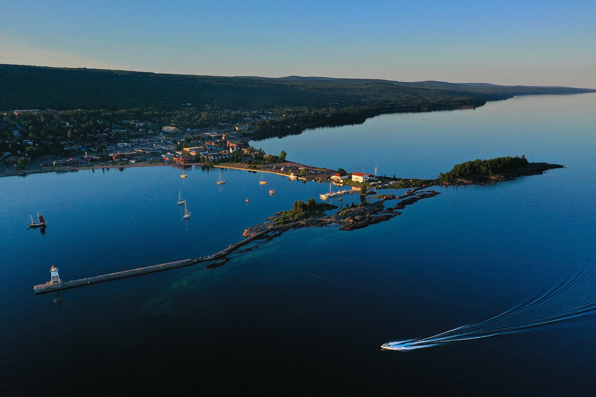 An aerial view of the harbor in Grand Marais, Minnesota, at sunset.